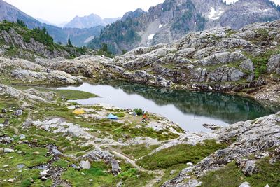 Scenic view of lake and mountains against sky