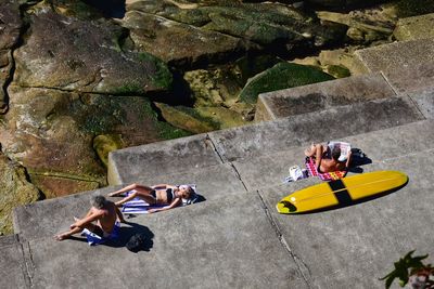 High angle view of people on rock