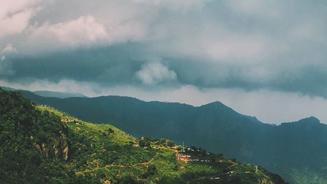 mountain, sky, mountain range, cloud - sky, scenics, tranquil scene, tranquility, beauty in nature, landscape, cloudy, nature, cloud, tree, high angle view, non-urban scene, hill, idyllic, outdoors, day, no people