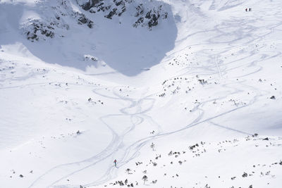 Ski alpinist passing alpine valley full of snow, wide shot, slovakia, europe