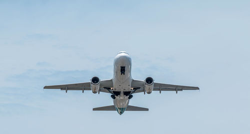 Low angle view of airplane in sky