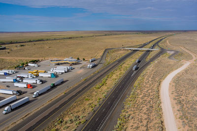 High angle view of cars on road against sky