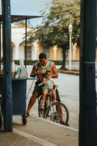 Man riding bicycle in city