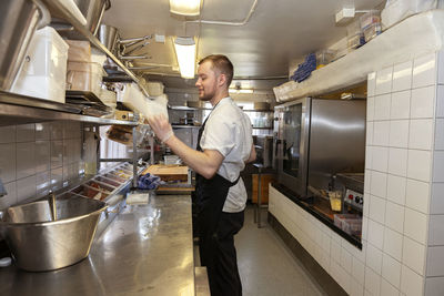 Man working in restaurant kitchen