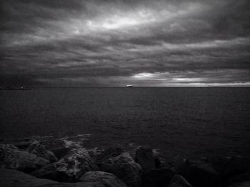 Scenic view of sea against cloudy sky