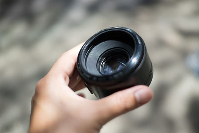 Midsection of person holding camera