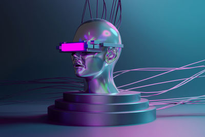 Close-up of artificial skull with illuminated vr headset