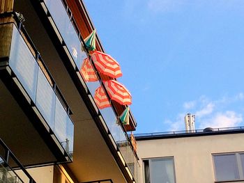 Low angle view of buildings against blue sky