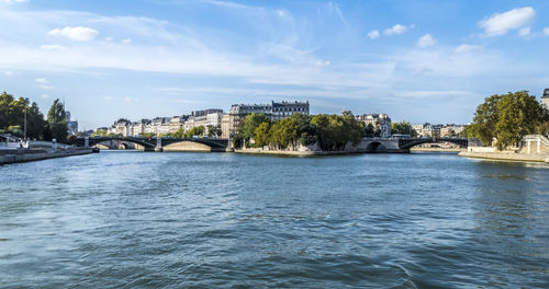 Beautiful buildings along the banks of the seine seen from the boat in paris