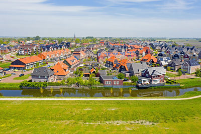 Aerial from the traditional village obdam in the countryside from the netherlands