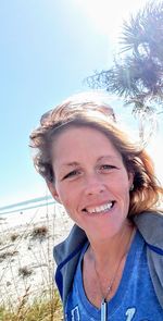 Portrait of smiling woman on beach