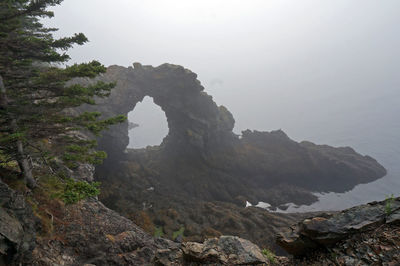 Scenic view of rock formation against sky