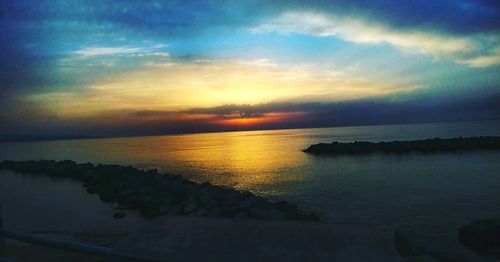 Scenic view of sea against sky during sunset