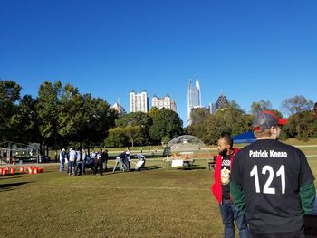 People at park against clear sky