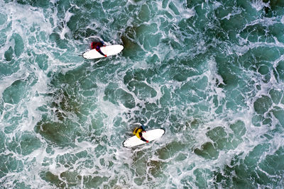 High angle view of people in sea