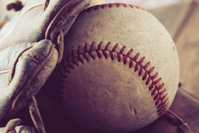 Close-up of baseball equipment on table