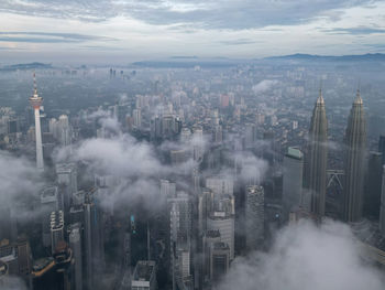 Aerial view of cityscape against sky