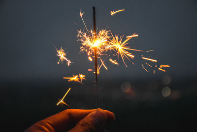 Low angle view of firework display at night
