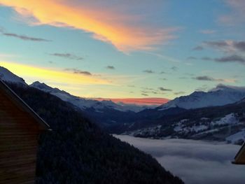 Scenic view of mountains against sky during sunset