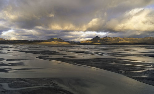 Scenic view of sea against dramatic sky