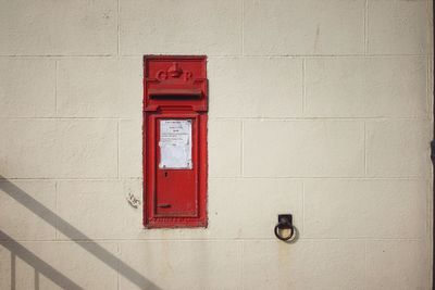 Postbox in wall