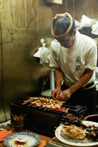 Man preparing food at store