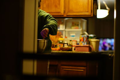 Close-up of person preparing food at home