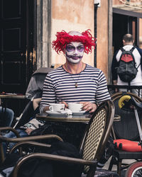 Portrait of man sitting in cafe