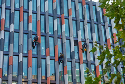 Low angle view of people walking on street