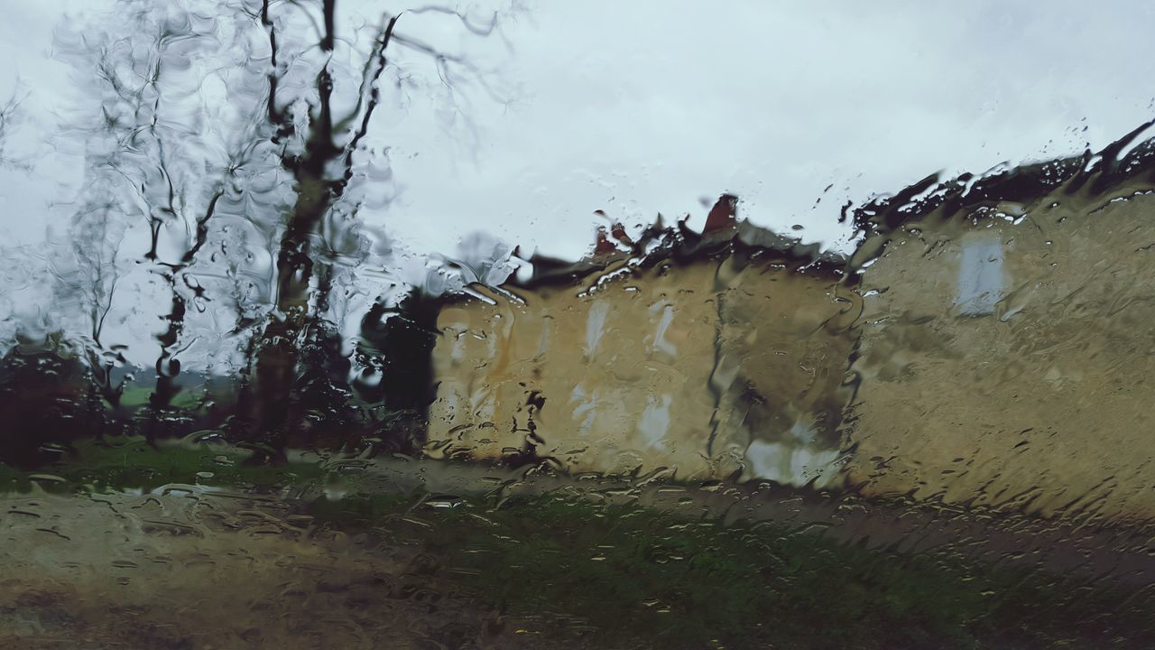 built structure, building exterior, architecture, sky, tree, water, weather, house, day, bare tree, nature, grass, no people, outdoors, plant, field, tranquility, season, old, growth