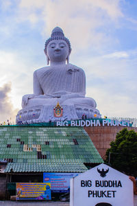 Low angle view of statue against sky