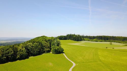 High angle view of golf course against clear sky