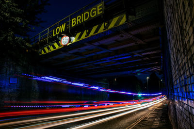 Light trails on road in city at night