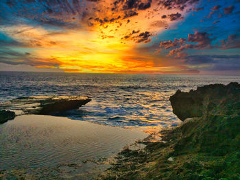 Scenic view of sea against sky during sunset