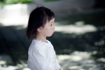 Side view of thoughtful girl looking away