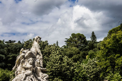 Low angle view of statue against sky