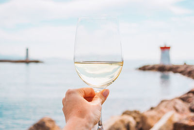 Close-up of hand holding wineglass