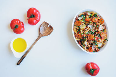 High angle view of breakfast on table against white background