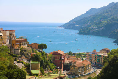 High angle view of townscape by sea