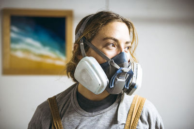 Portrait of female resin artist in homemade art studio