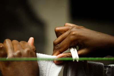 Cropped image of person hanging laundry