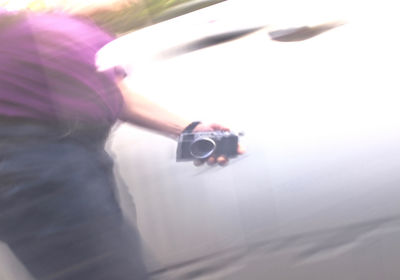 Close-up of person holding umbrella