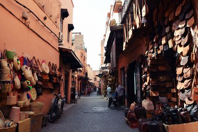 People at street market amidst buildings in city