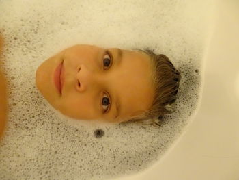 Close-up portrait of baby girl in bathroom