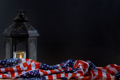 Close-up of flag on table against building