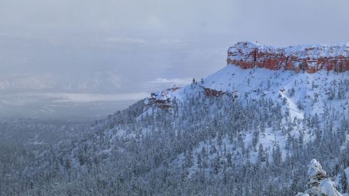 Scenic view of mountain against sky during winter