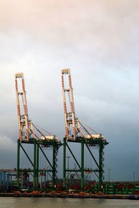 Cranes against sky