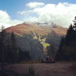 Scenic view of mountains against cloudy sky