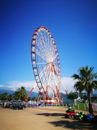 Ferris wheel against clear blue sky