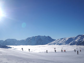 Scenic view of mountains against blue sky